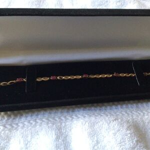 10K gold bracelet with synthetic gems
